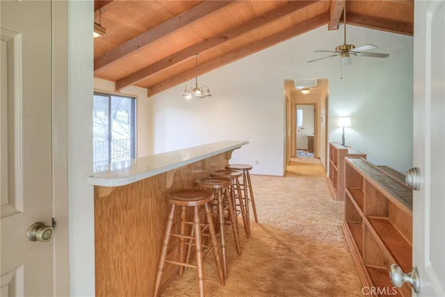 a view of room with window and a ceiling fan