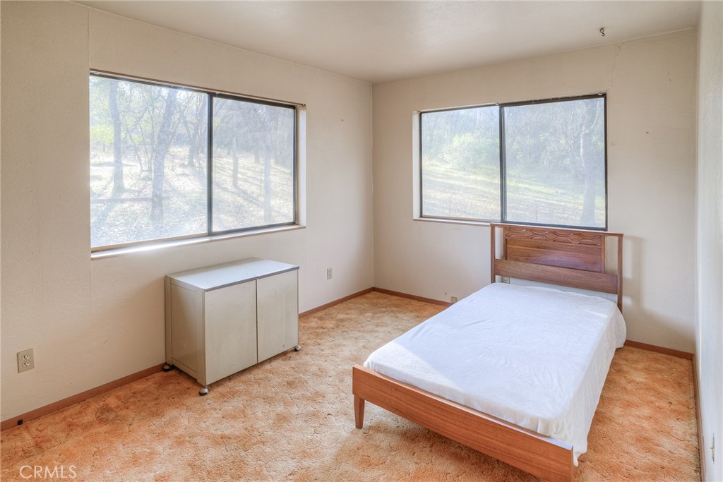 15 Hide A Way Road Oroville, CA 95966 - Photo 8 of 63 a view of room with window and a ceiling fan