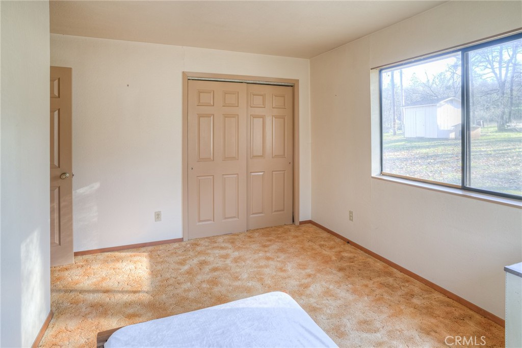 15 Hide A Way Road Oroville, CA 95966 - Photo 9 of 63 an empty room with a window
