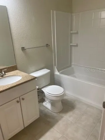 a bathroom with a toilet a sink and bathtub