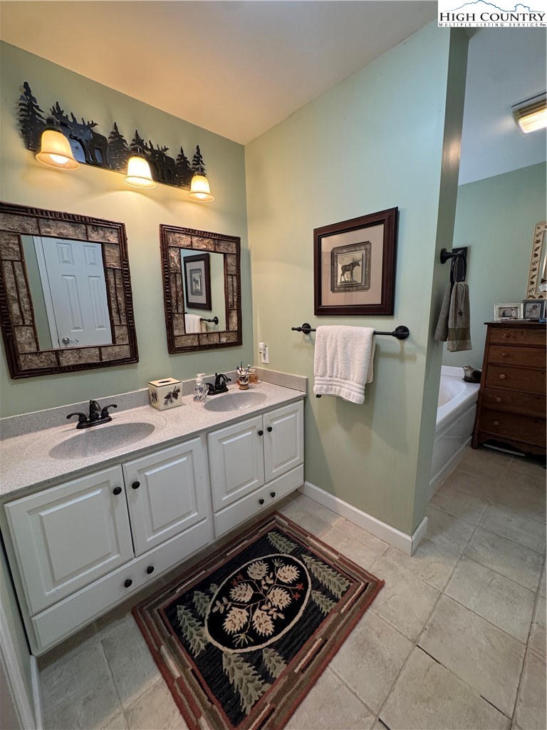 128 Hillcrest Road Newland, NC 28657 - Photo 13 of 37 a room with two washing machine and sink