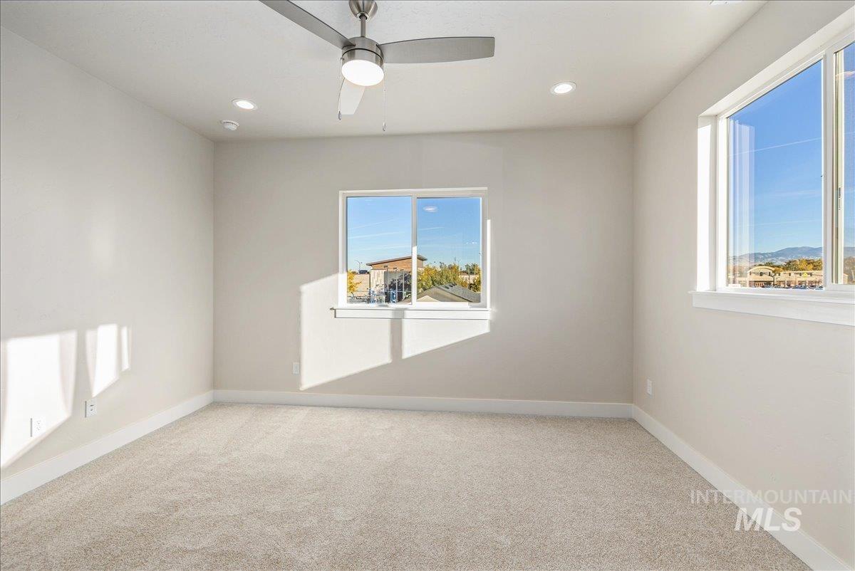 1408 North Cole Road Boise, ID 83704 - Photo 26 of 32 Recessed lighting, ceiling fan, and multiple windows