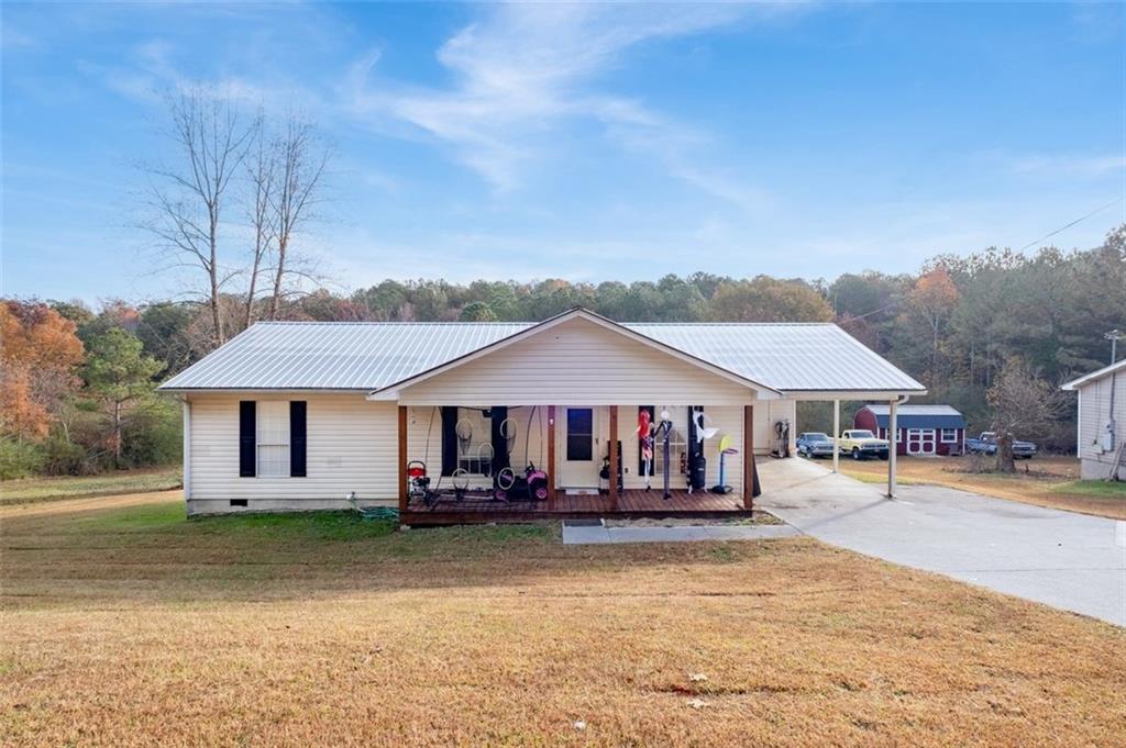 288 Spring Drive Southeast Calhoun, GA 30701 - Photo 1 of 1 a front view of a house with a yard