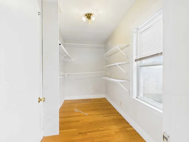 a utility room with cabinets washer and dryer