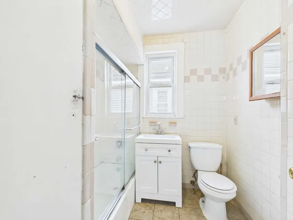 a front view of house with a garden