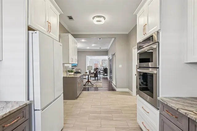 a view of a kitchen with furniture and staircase