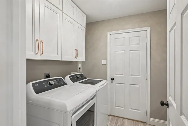 a utility room with dryer and washer