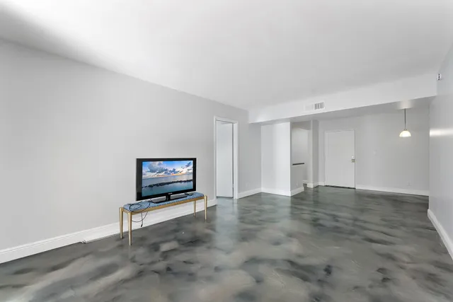 a view of a room with a flat screen tv