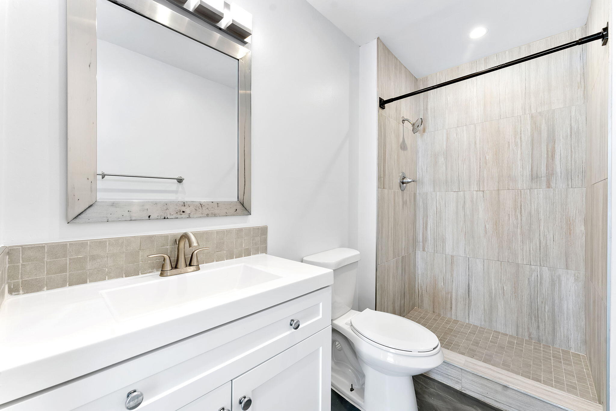 470 Northwest 20th Street, Unit 3070 Boca Raton, FL 33431 - Photo 8 of 22 a bathroom with a sink toilet and shower