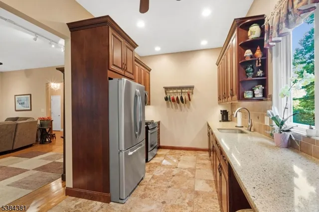 a view of a chandelier and a livingroom with furniture window