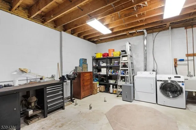 a view of balcony with furniture and umbrella