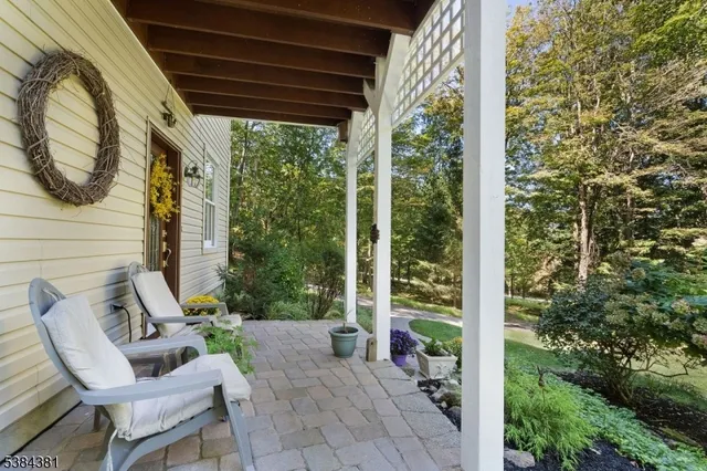a view of two chairs in the balcony
