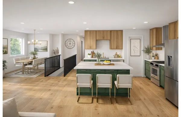 a large kitchen with a table and chairs