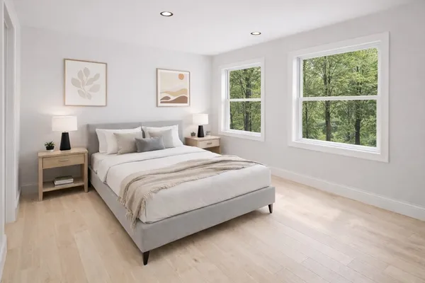 a bedroom with a bed and window