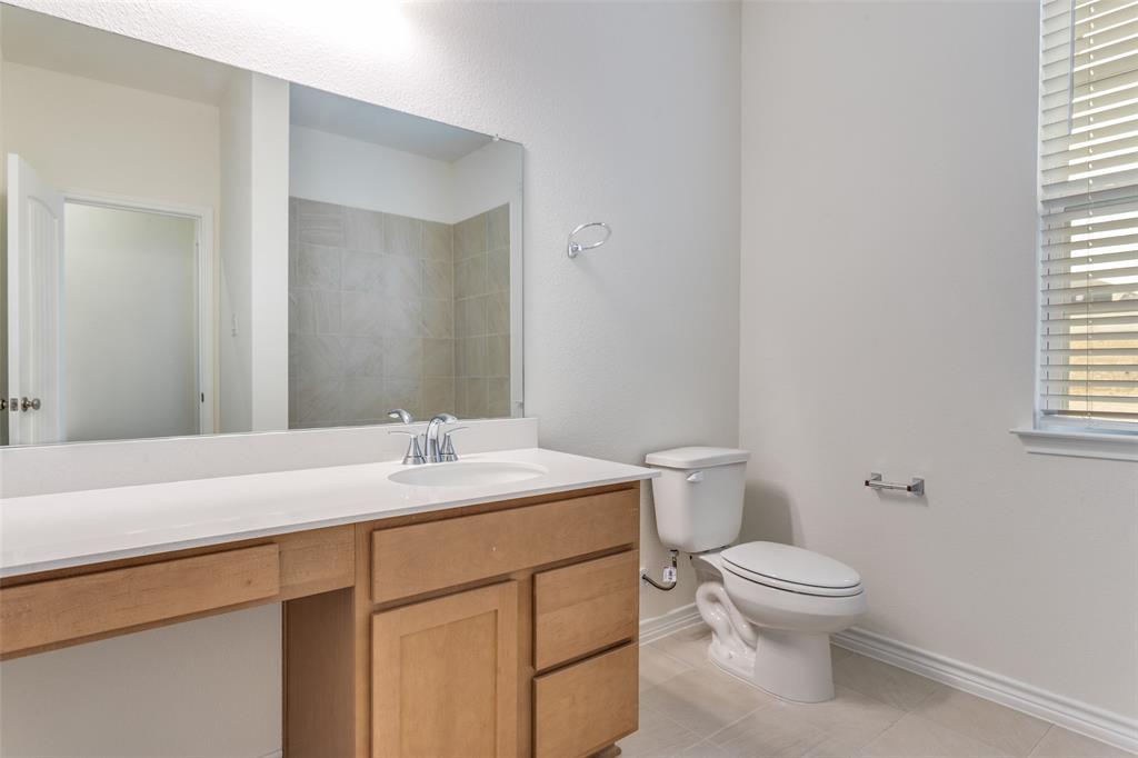 649 Fallbrook Drive Aledo, TX 76008 - Photo 15 of 30 a bathroom with a sink and a toilet