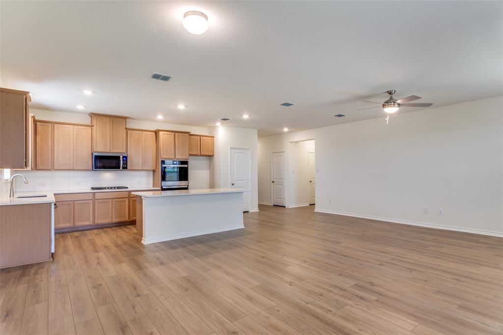 649 Fallbrook Drive Aledo, TX 76008 - Photo 8 of 30 a view of kitchen with granite countertop stainless steel appliances refrigerator sink and cabinets
