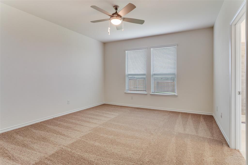 649 Fallbrook Drive Aledo, TX 76008 - Photo 10 of 30 an empty room with windows and fan