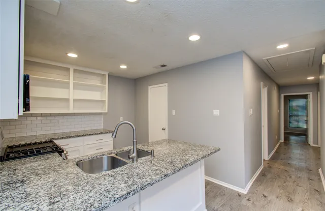a kitchen with sink and window