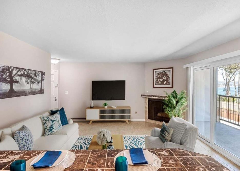 815 Balboa Avenue, Unit 206 Capitola, CA 95010 - Photo 3 of 6 a living room with furniture and a flat screen tv