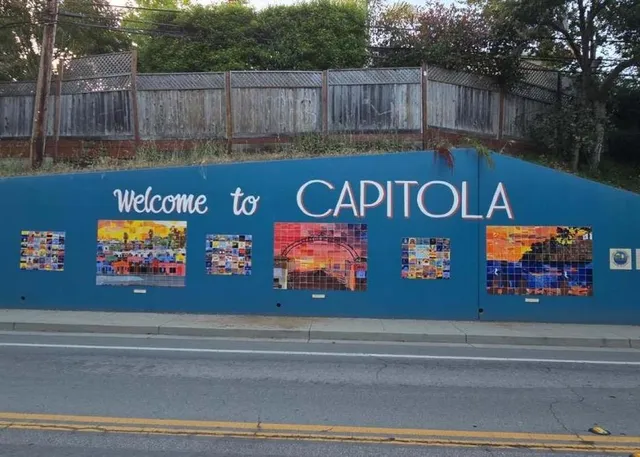 a sign that is on the side of the street