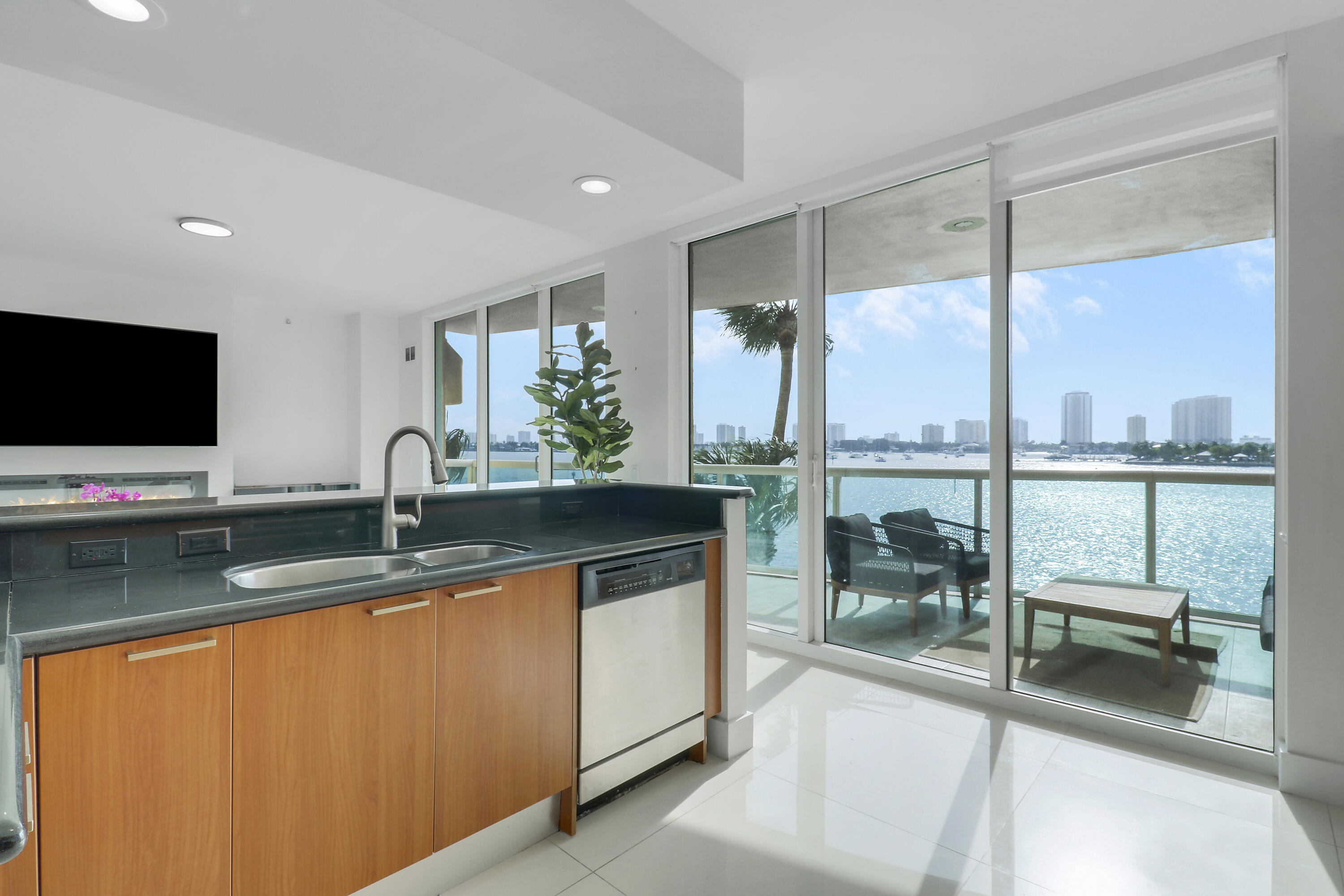 2640 Lake Shore Drive, Unit 307 Riviera Beach, FL 33404 - Photo 10 of 44 a kitchen with a large window and a sink