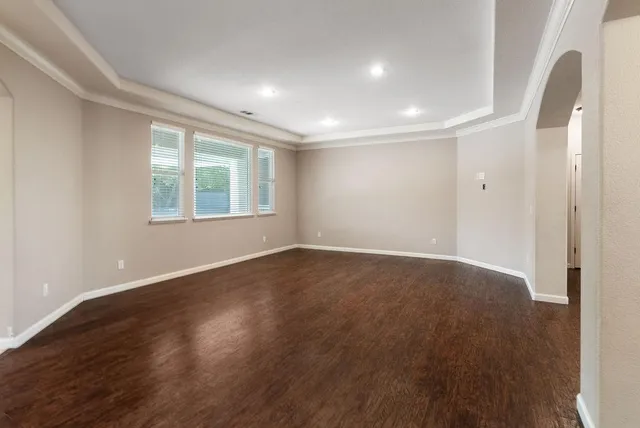 a view of an empty room and wooden floor