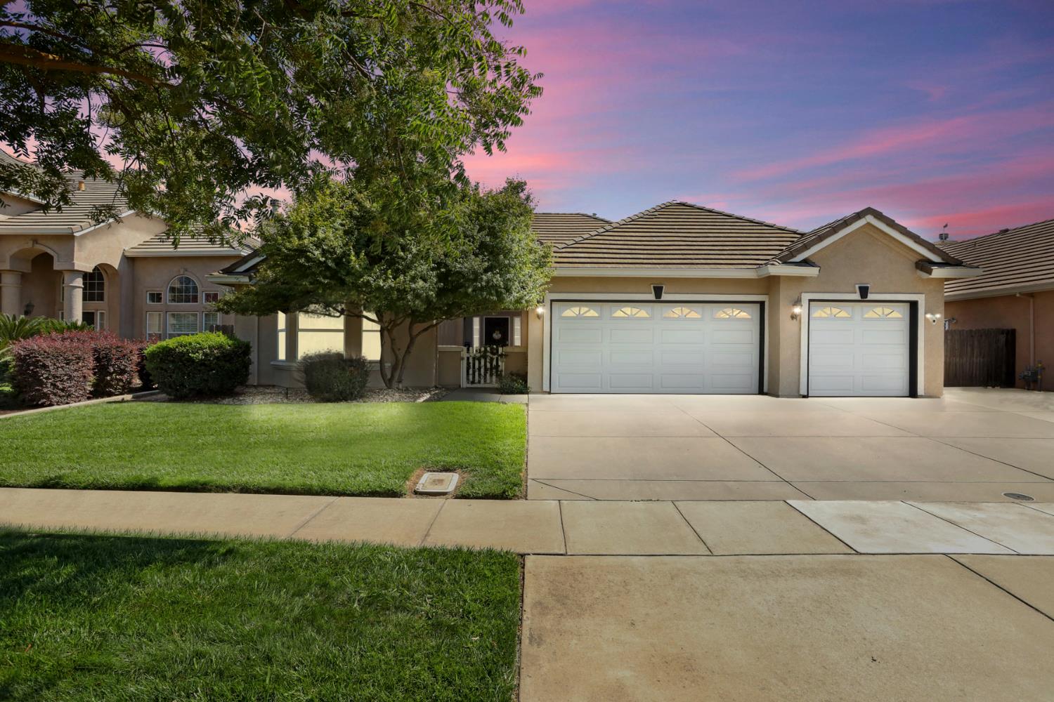 3604 Hillglen Avenue Modesto, CA 95355 - Photo 2 of 56 a front view of a house with a garden