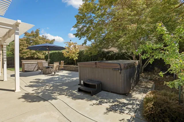 a view of backyard with sitting area