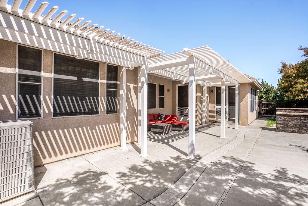 3604 Hillglen Avenue Modesto, CA 95355 - Photo 55 of 56 a view of a house with wooden deck and furniture