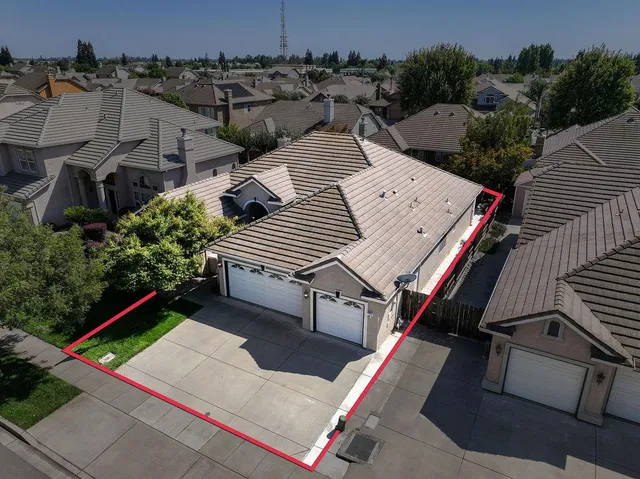 an empty room with closet and a chandelier fan