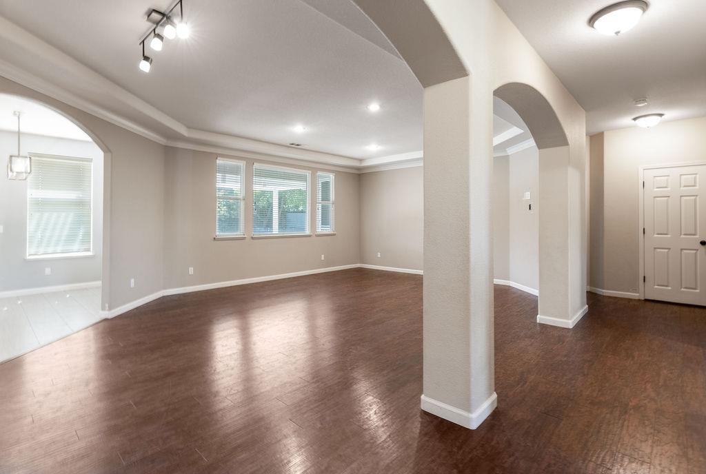 3604 Hillglen Avenue Modesto, CA 95355 - Photo 10 of 56 an empty room with wooden floor and windows
