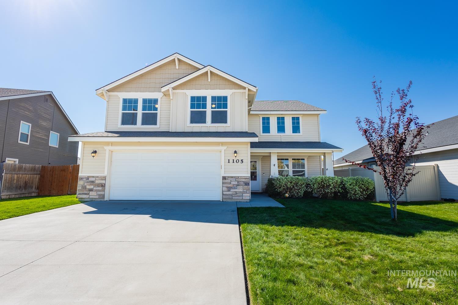 Craftsman-style home featuring stone siding, concrete driveway, an attached garage, and a porch