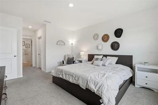 a bedroom with a bed and cabinets