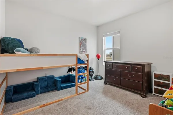 a bed room with a bed and a desk