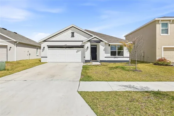 a view of house with yard