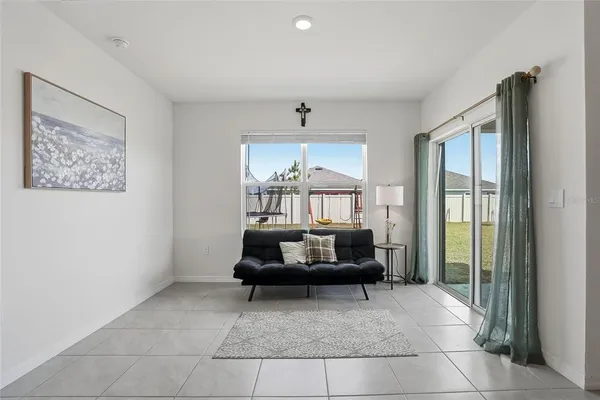 a living room with furniture and a window
