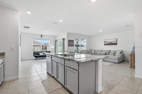 a kitchen with stainless steel appliances granite countertop a sink and cabinets
