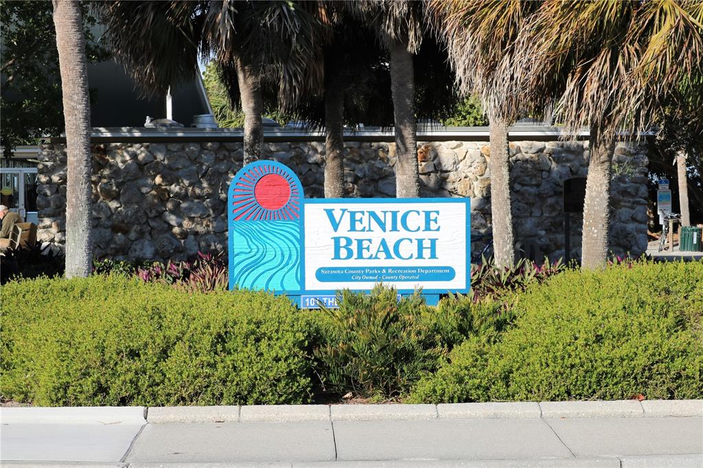 4266 Summertree Road Venice, FL 34293 - Photo 62 of 64 a view of outdoor space with signage and flags