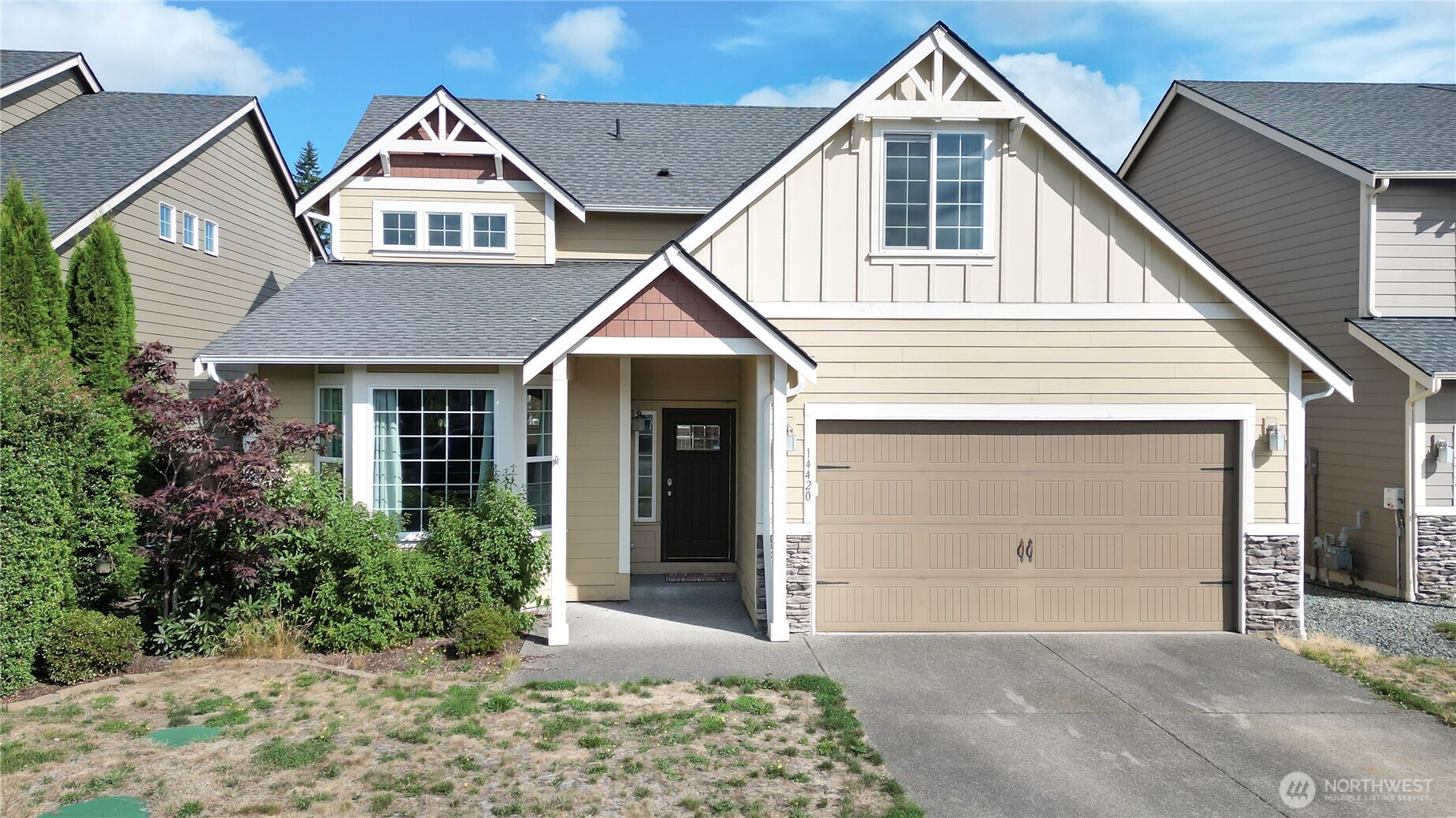 a front view of a house with a yard