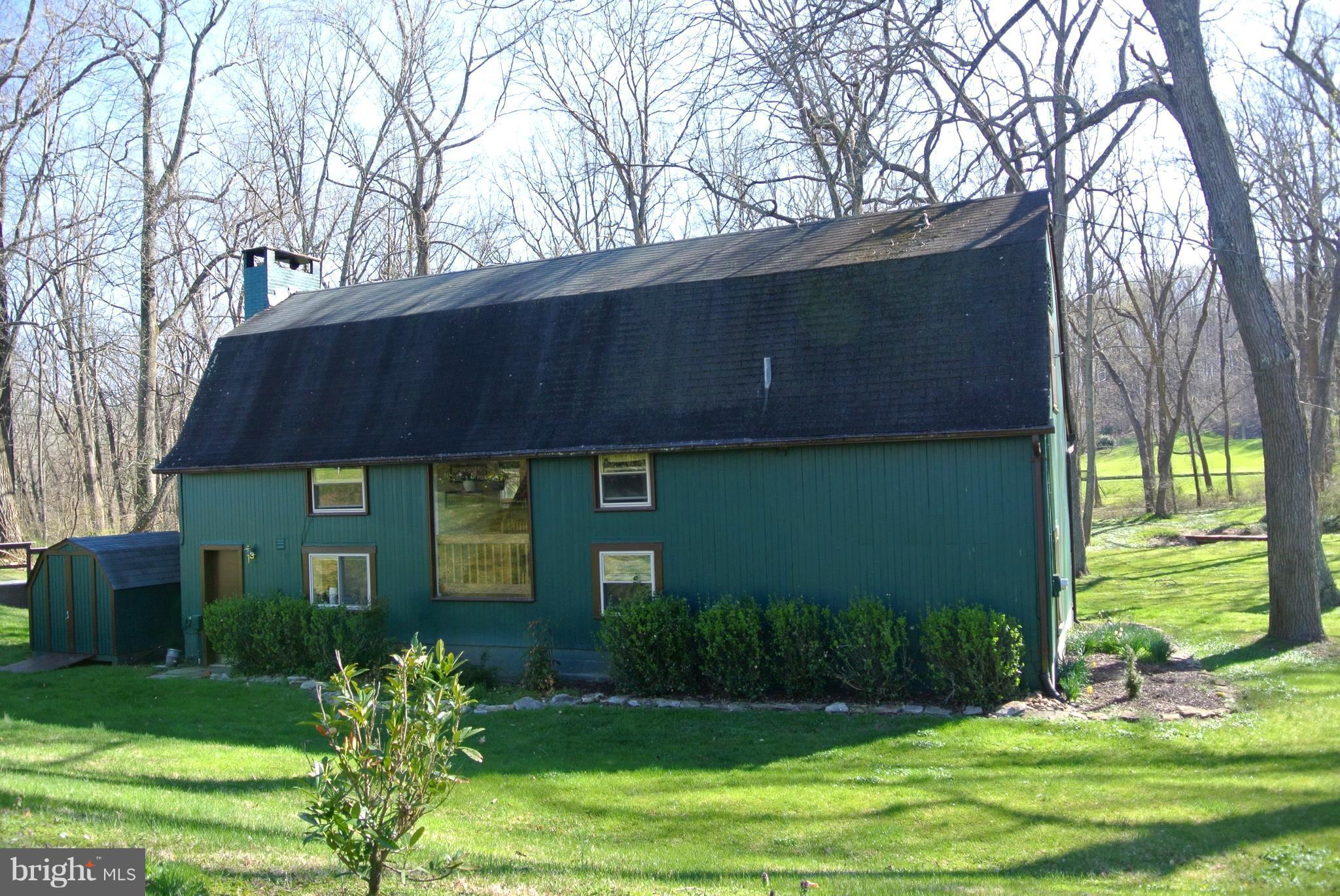3864 Butler Road Reisterstown, MD 21136 - Photo 18 of 24 a front view of a house with garden