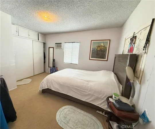 a view of kitchen with furniture and refrigerator