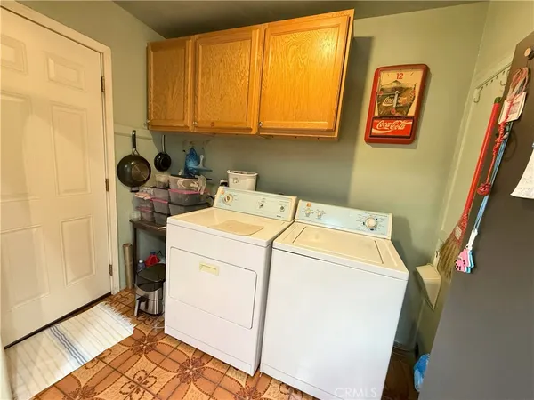 a front view of house with a garden