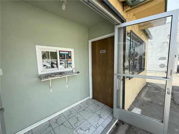 a room with gym equipment and a large window