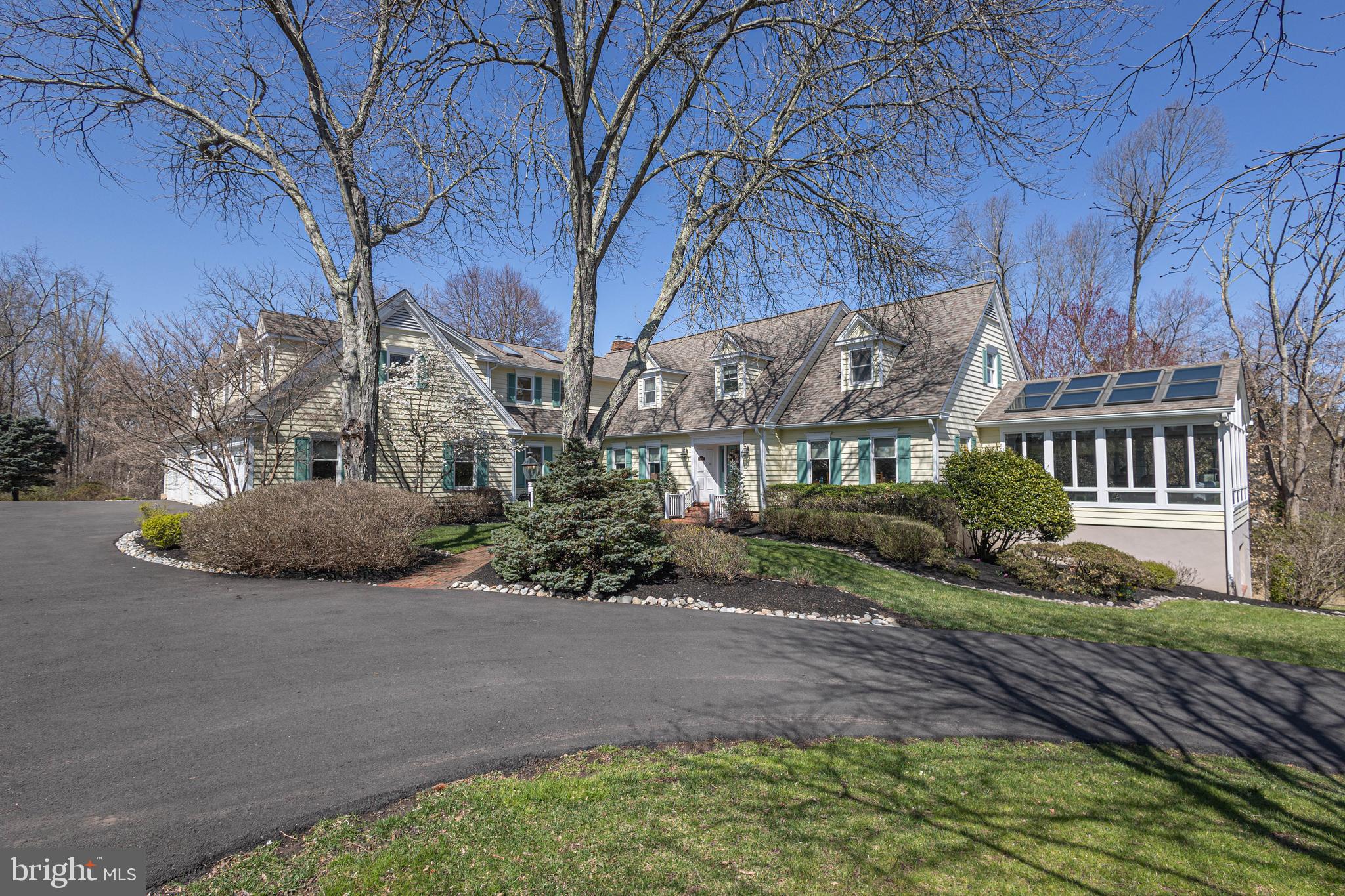 a view of a house with a yard and plants