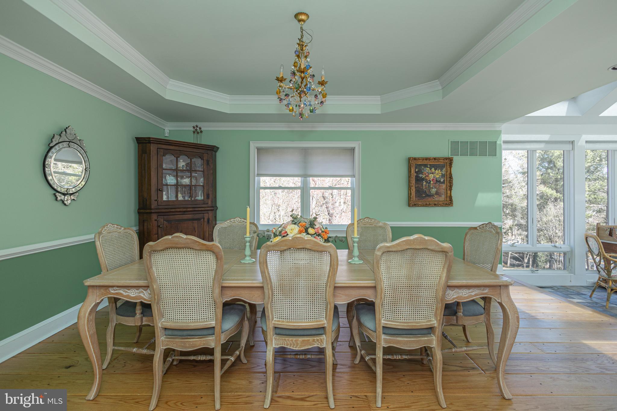 1045 Washington Crossing Road Newtown, PA 18940 - Photo 13 of 67 a dining room with furniture a chandelier and wooden floor