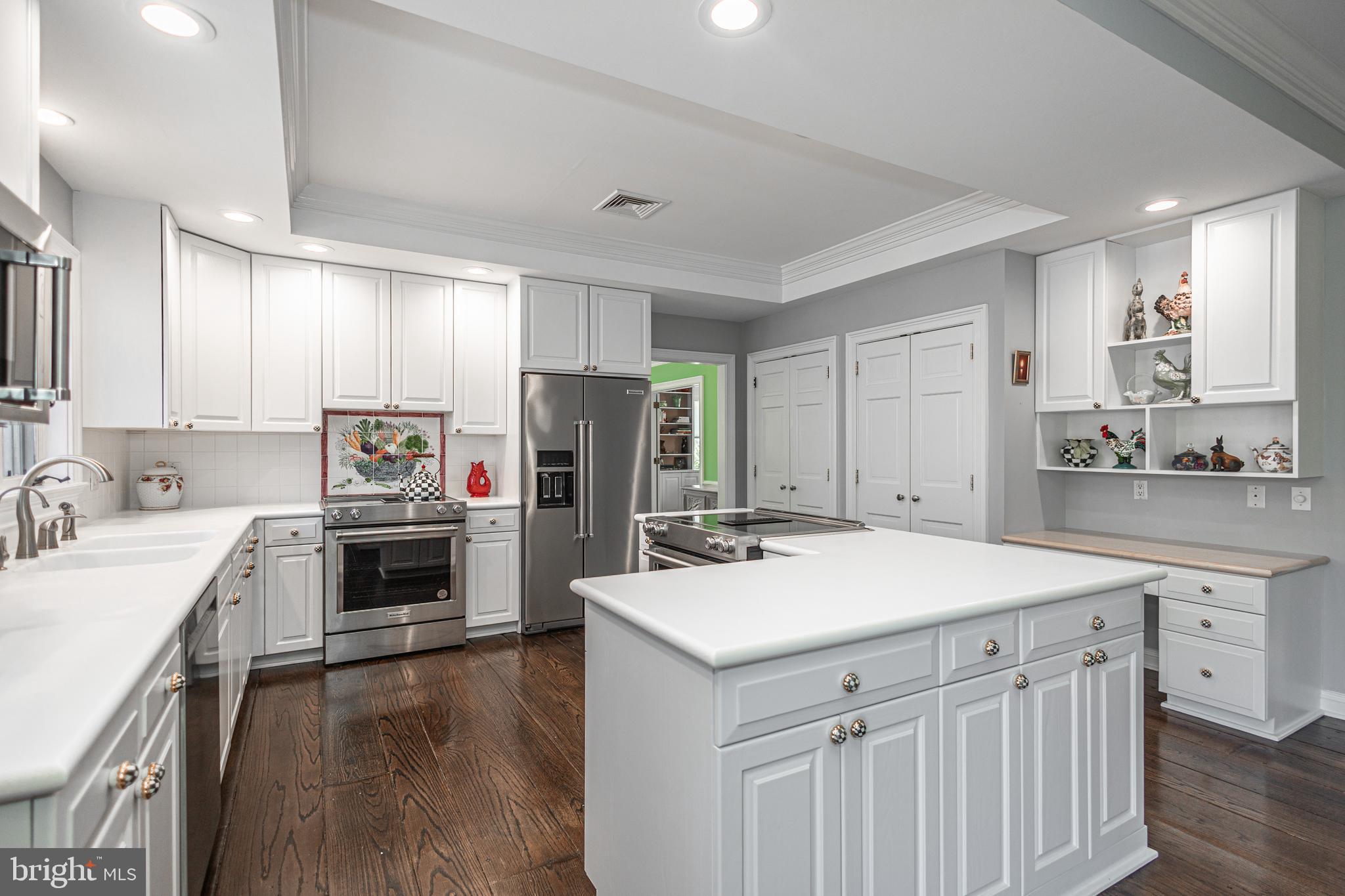 1045 Washington Crossing Road Newtown, PA 18940 - Photo 18 of 67 a kitchen with a sink a stove a refrigerator a center island and a oven