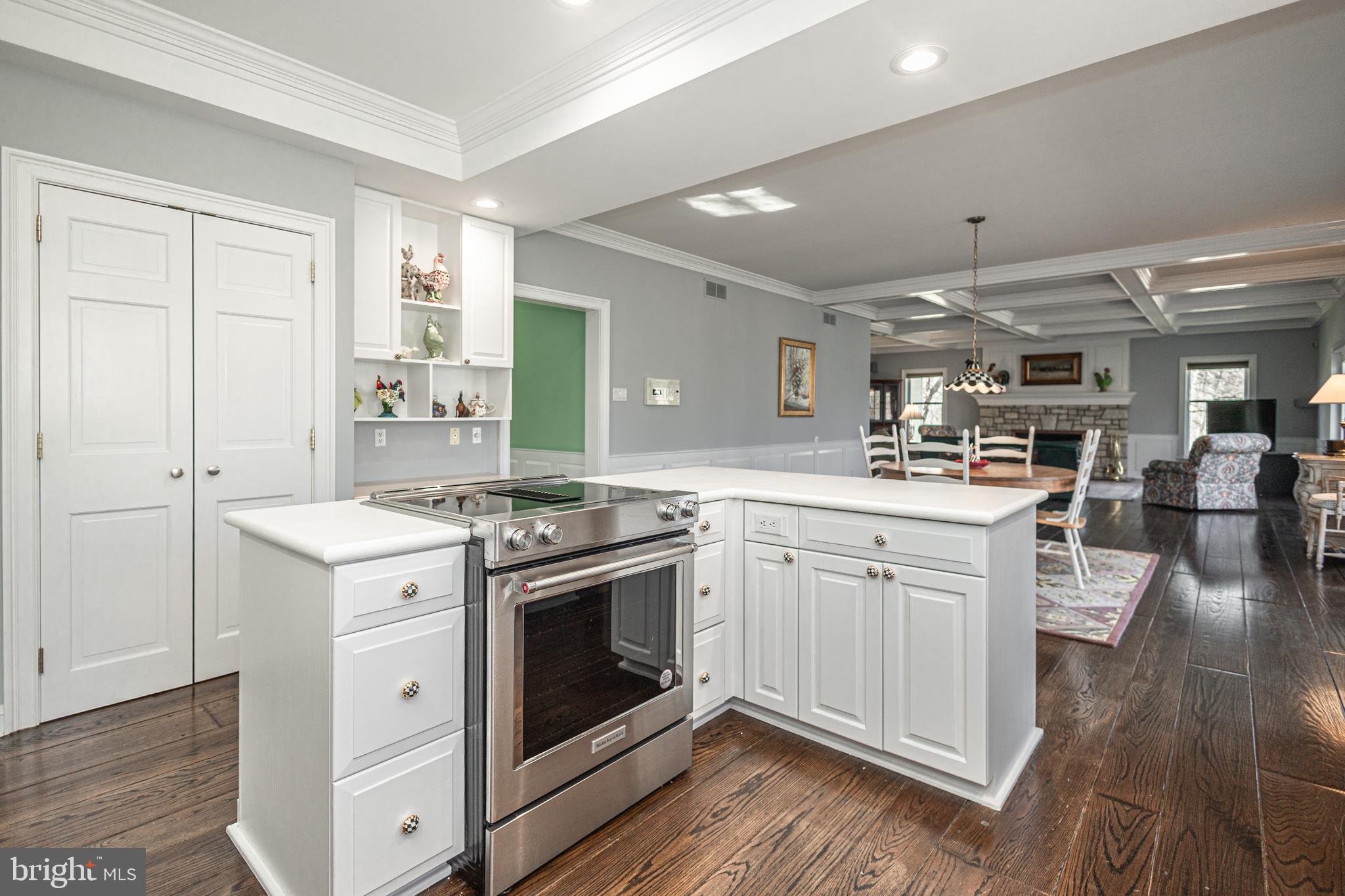 1045 Washington Crossing Road Newtown, PA 18940 - Photo 19 of 67 a kitchen with stainless steel appliances granite countertop a stove and white cabinets