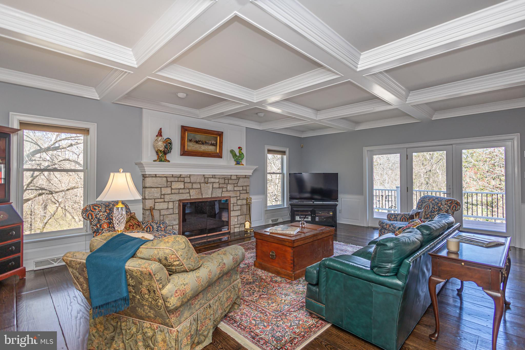 1045 Washington Crossing Road Newtown, PA 18940 - Photo 22 of 67 a living room with furniture flat screen tv and a fireplace