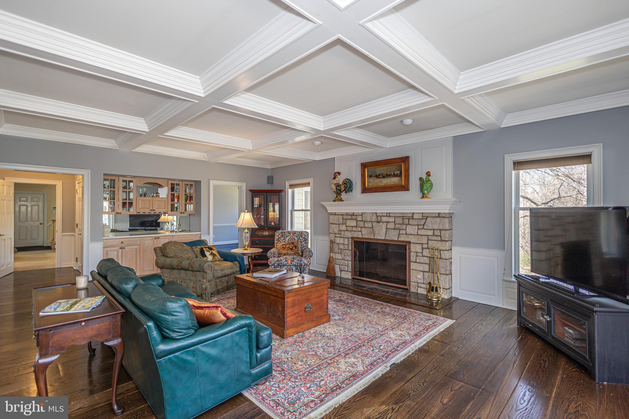 1045 Washington Crossing Road Newtown, PA 18940 - Photo 23 of 67 a living room with furniture a flat screen tv and a fireplace
