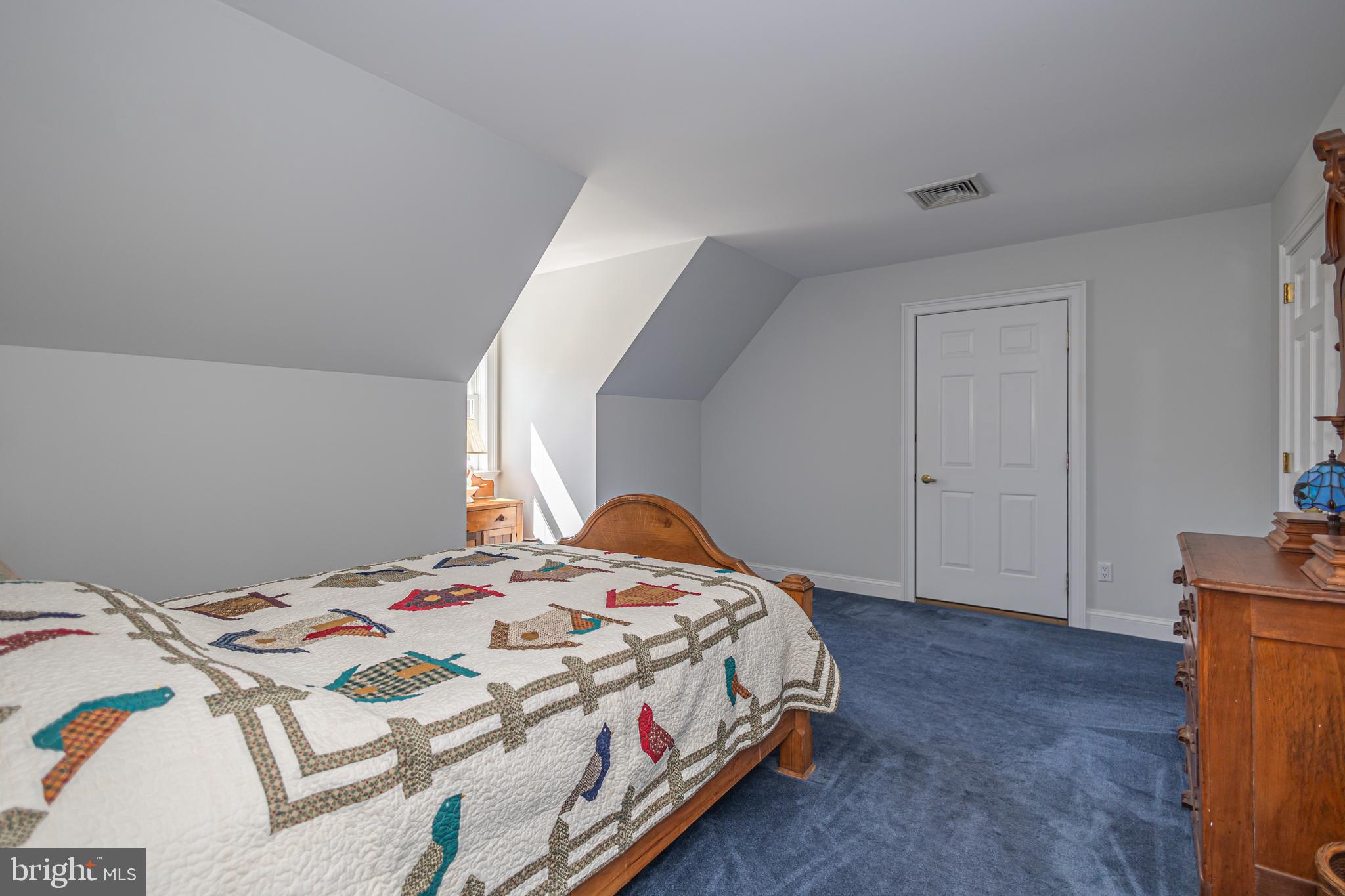 1045 Washington Crossing Road Newtown, PA 18940 - Photo 32 of 67 a bedroom with a bed and a cabinets